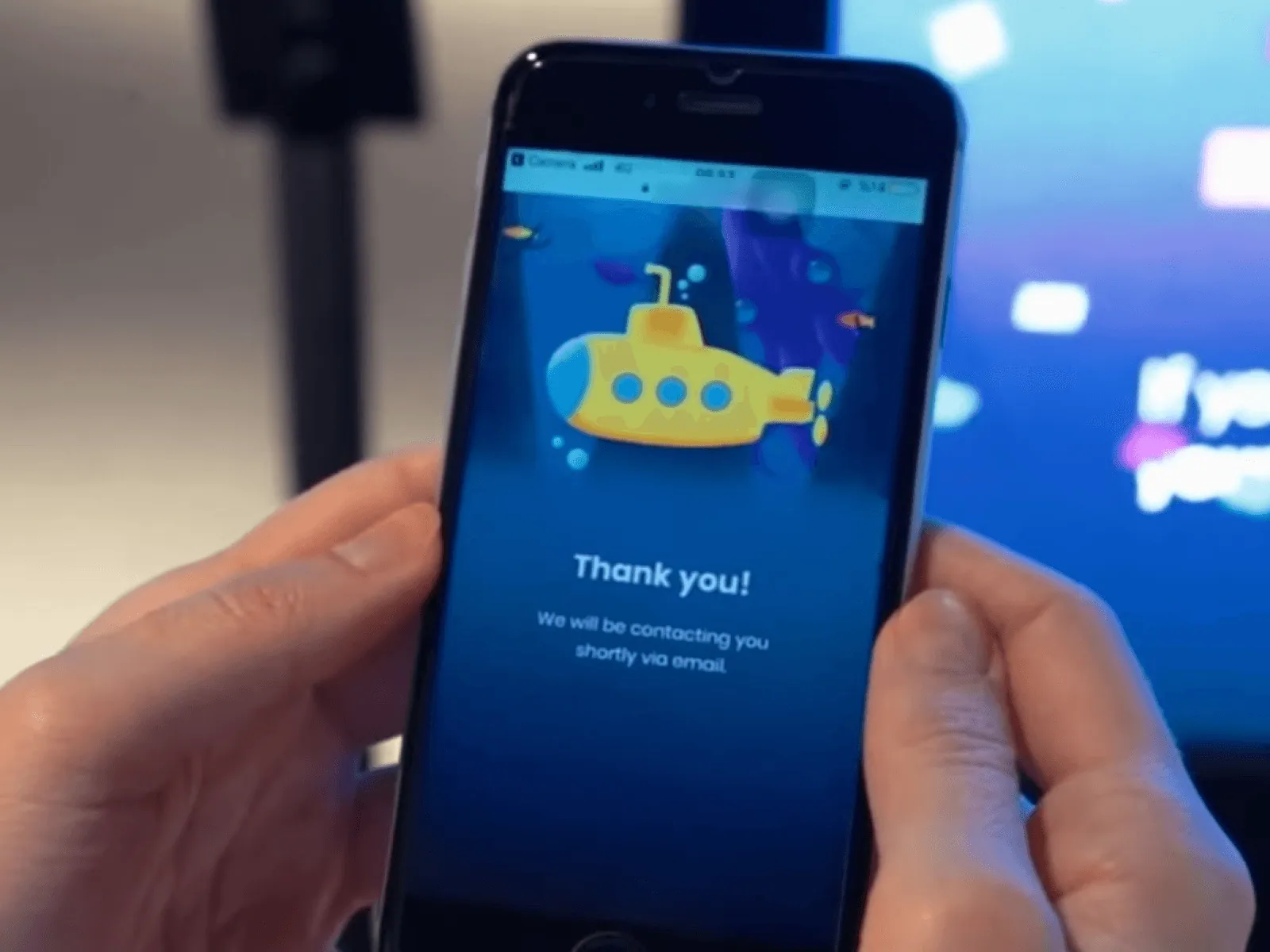 The game's 'Thank you' confirmation screen on a customer's phone